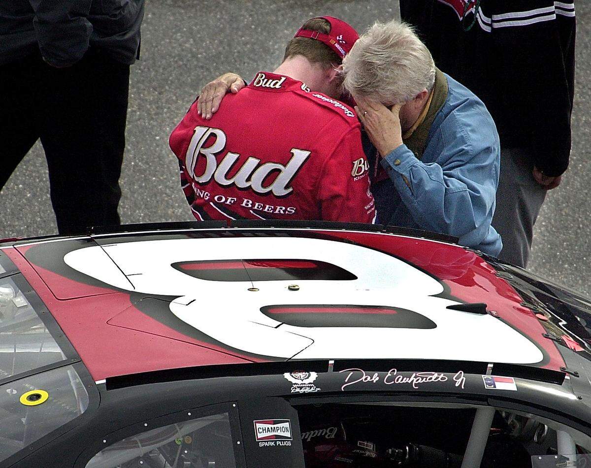 02/25/01: NASCAR driver Dale Earhardt Jr. prays with Max Helton, the senior chaplin for ministry racing outreach, prior to the strat of the Dura-Lube 40o, Sunday afternoon February 25, 2001, at the North Carolina Motor Speedway, in Rockingham, NC. Jr. crashed on the first lap of the race and his day was over. PATRICK SCHNEIDER/STAFF