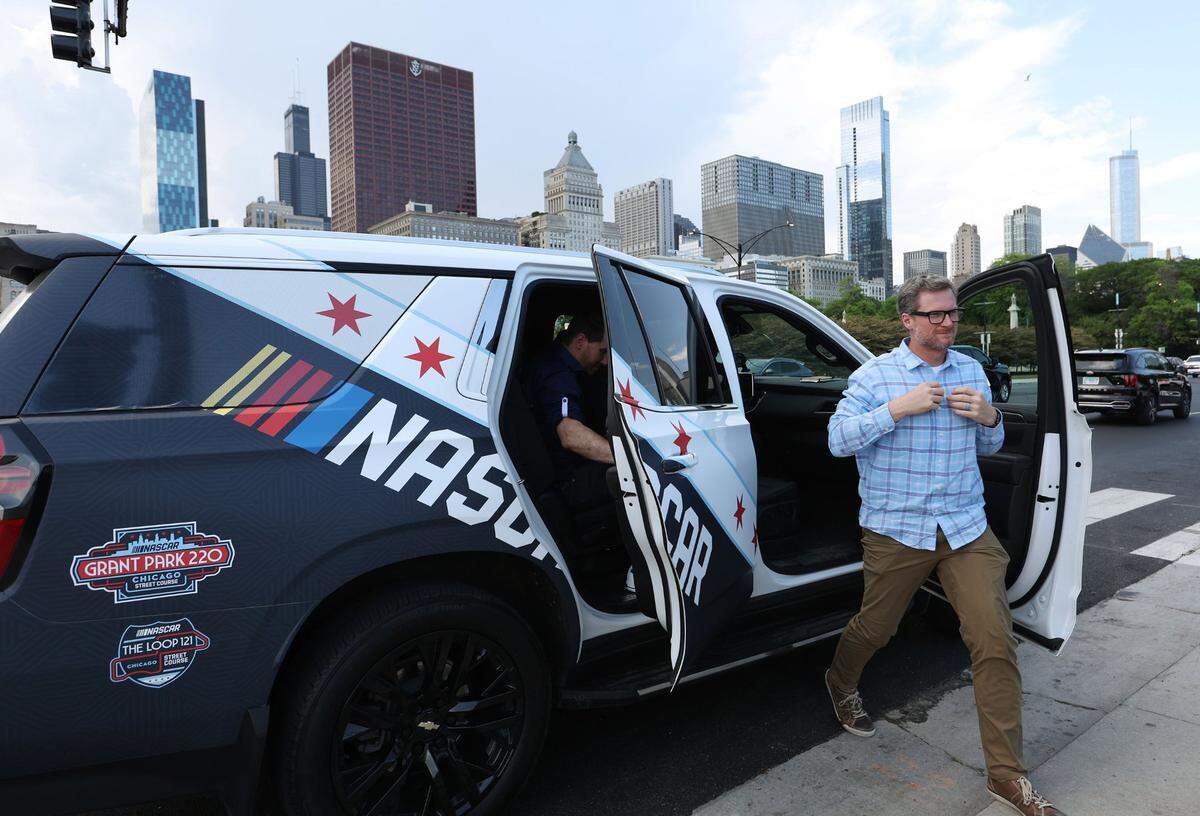 Race car driver Dale Earnhardt Jr. exits an SUV after viewing the course layout for the upcoming NASCAR race, May 31, 2023, in Chicago. (John J. Kim/Chicago Tribune/TNS)