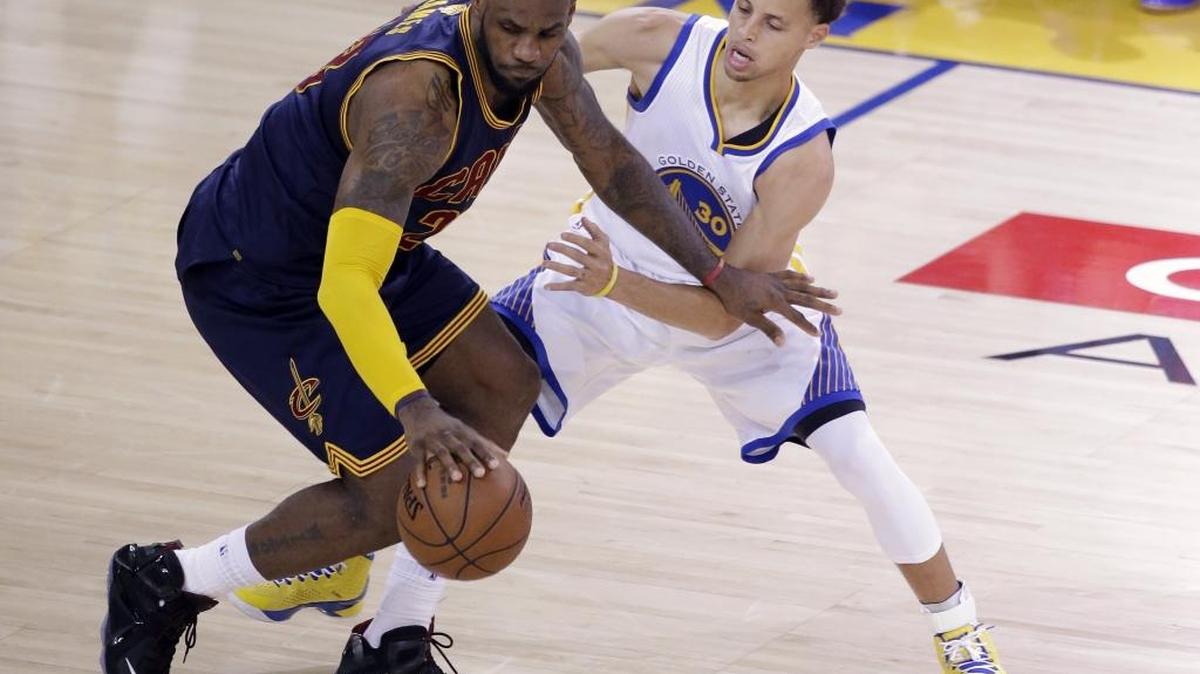 FILE - In this June 7, 2015, file photo, Cleveland Cavaliers forward LeBron James, left, is guarded by Golden State Warriors guard Stephen Curry during the second half of Game 2 of basketball's NBA Finals in Oakland, Calif. This Cleveland-Golden State series will mark the 14th time that there's been a rematch in the NBA Finals. Good news for the Cavs: Six of the last seven teams coming off a Finals loss won the rematch. (AP Photo/Eric Risberg, File)