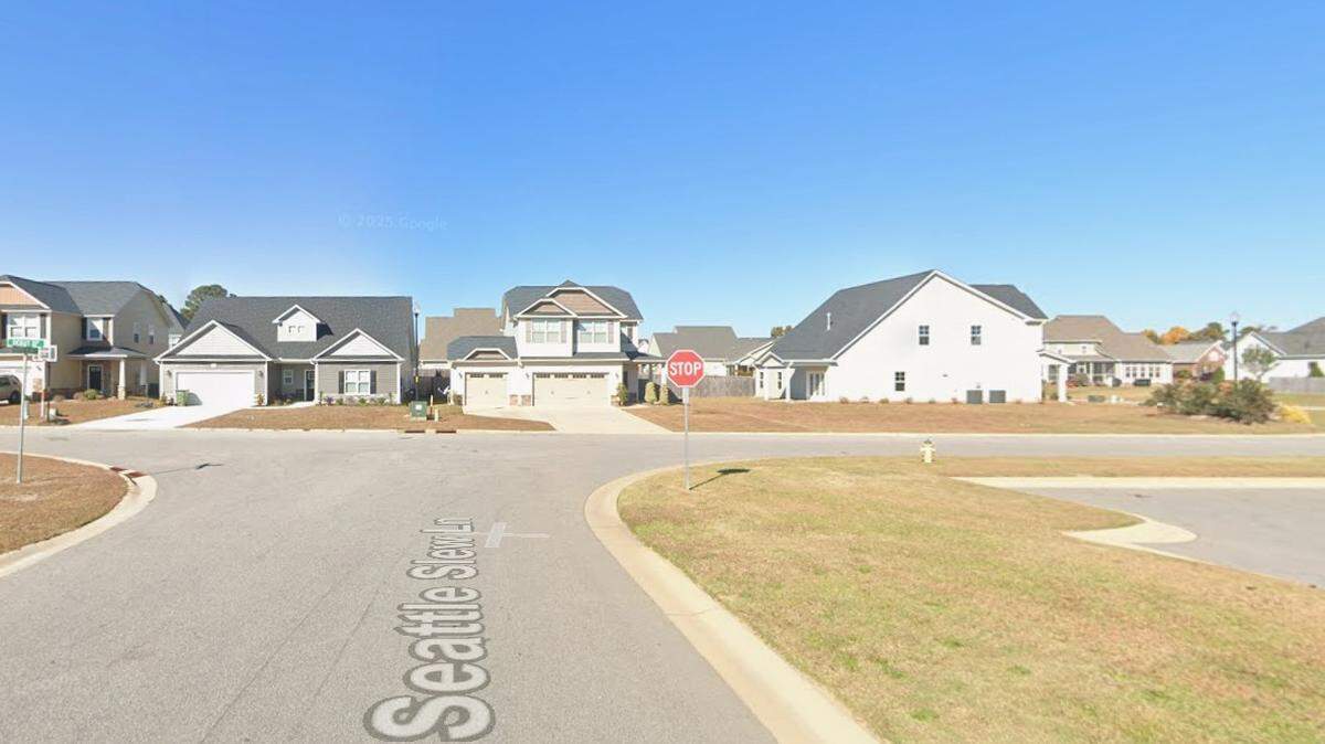 An off-duty police officer is accused of killing another off-duty officer in a domestic incident along this sleepy block in Cumberland County NC, the sheriff said.