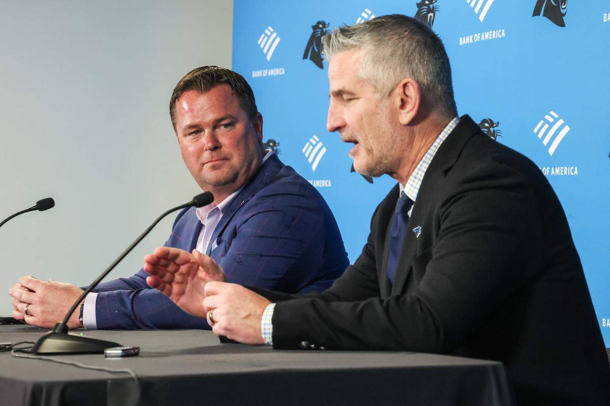 General manager Scott Fitterer, left, and head coach Frank Reich, speak to the media in April.