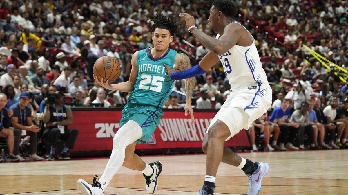 Charlotte Hornets guard KJ Simpson (25) drives to the net against Philadelphia 76ers forward Justin Edwards (19) in the fourth quarter of their game at Thomas & Mack Center.