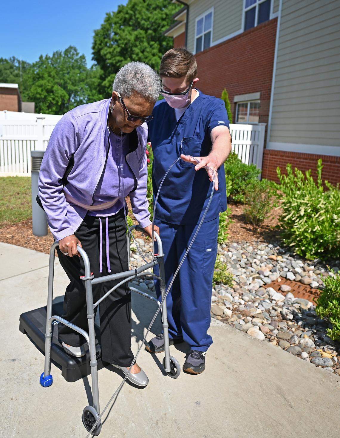 Matt Saunders, a physical therapist at the Abernethy Laurels nursing home in Newton, N.C., works with resident Bettye Coulter to strengthen her gait.