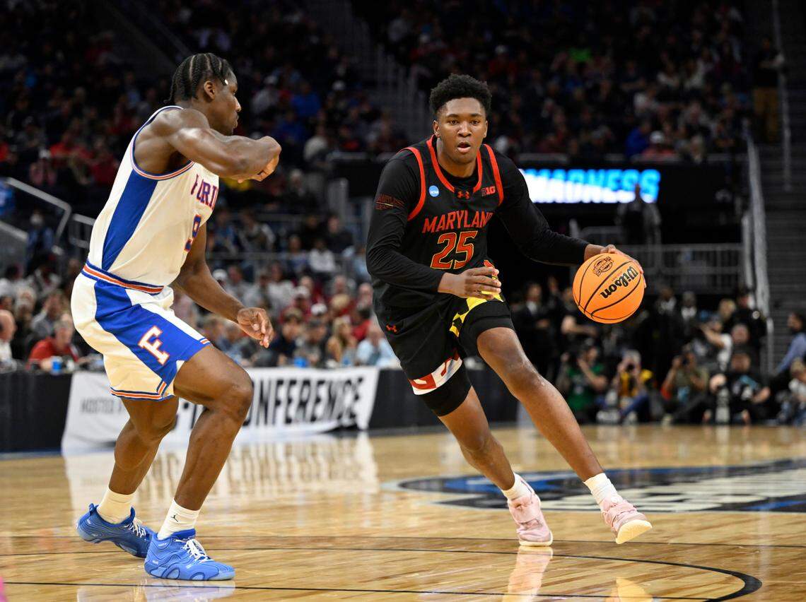 Mar 27, 2025; San Francisco, CA, USA; Maryland Terrapins center Derik Queen (25) dribbles down court past Florida Gators center Rueben Chinyelu (9) during the second half during a West Regional semifinal of the 2025 NCAA tournament at Chase Center. Mandatory Credit: Eakin Howard-Imagn Images