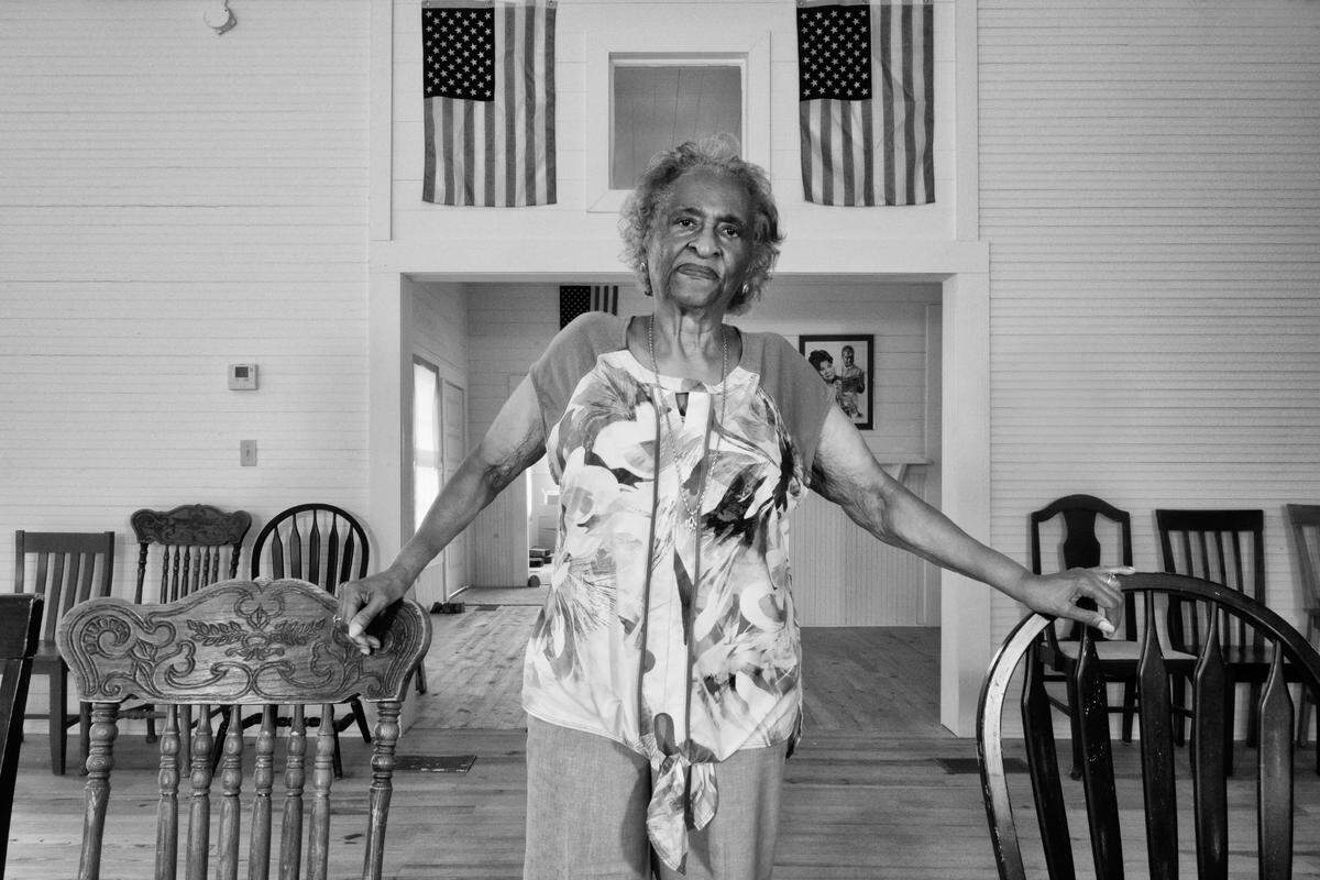 Ellie Dahmer, a former Rosenwald student and teacher, in an old Forrest County, Mississippi, Rosenwald school. This is one of the photos in a new exhibition about the Jim Crow-era schools at the Charlotte Museum of History.
