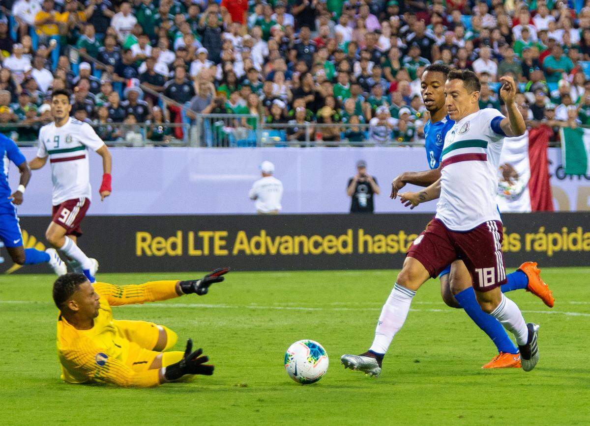 Mexico’s Andres Guardado, right, drives towards the goal as Martinique’s goalie Loic Chauvet, right, and Jordy Delem try to block the play during a Group A match in the 2019 CONCACAF Gold Cup at Bank of America Stadium in Charlotte on Sunday.