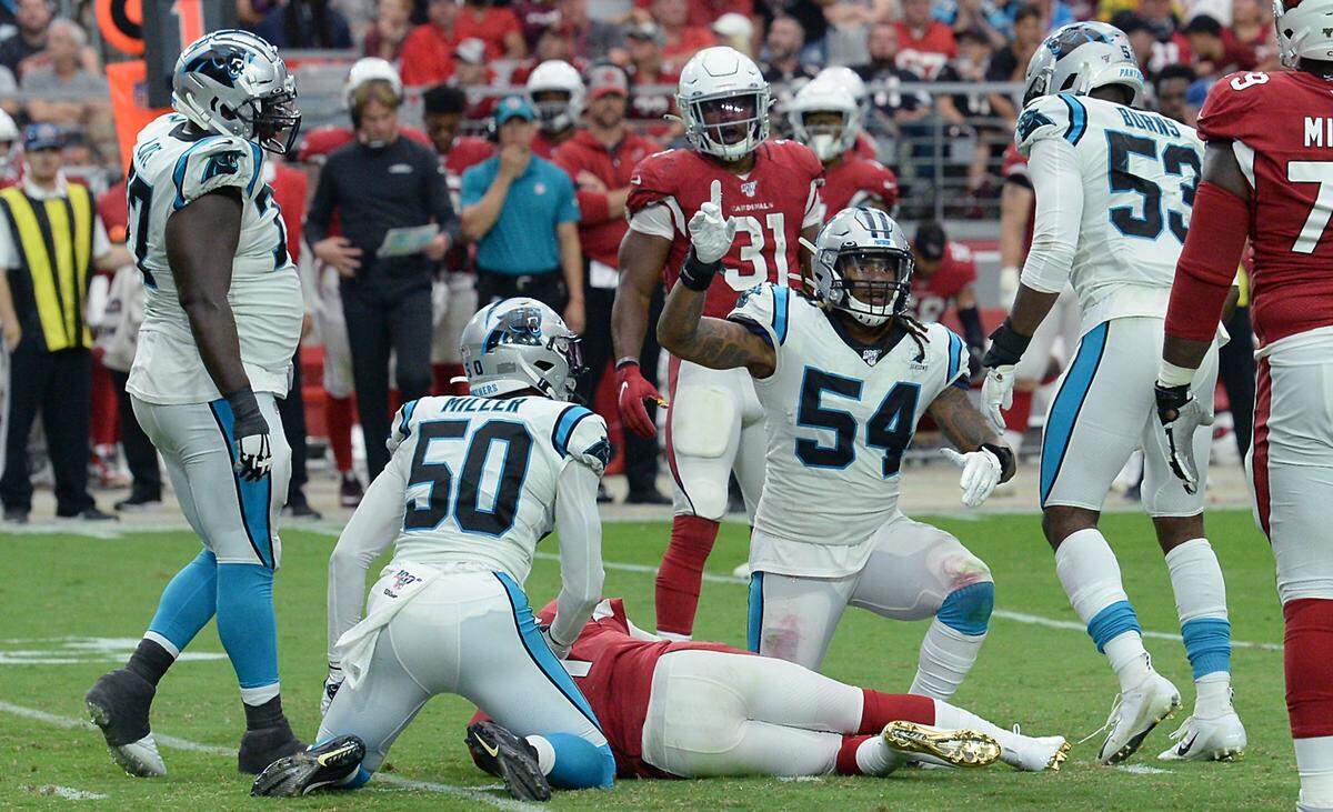 Carolina Panthers linebacker Shaq Thompson (54) celebrates a sack of Arizona Cardinals quarterback Kyler Murray in September 2019. The Panthers sacked Murray eight times that day.