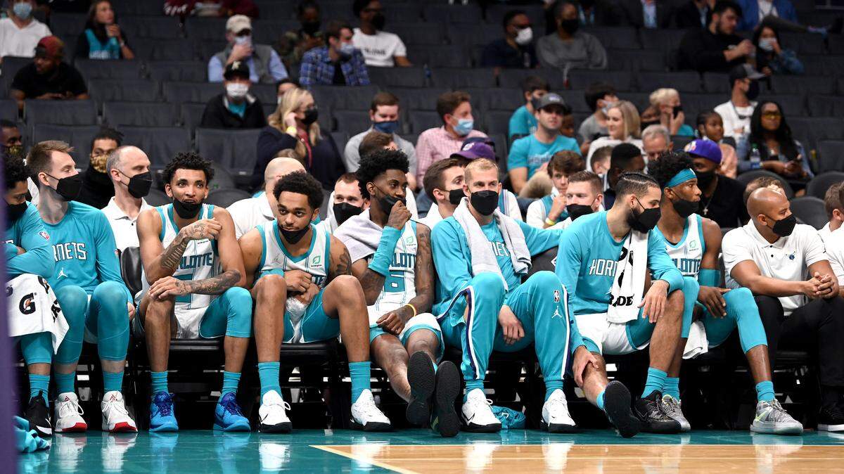 Members of the Charlotte Hornets team can only sit on the bench and watch as the Dallas Mavericks continue to increase their lead during fourth quarter action on Wednesday, October 13, 2021 at Spectrum Center in Charlotte, NC. The Mavericks defeated the Hornets 127-59.