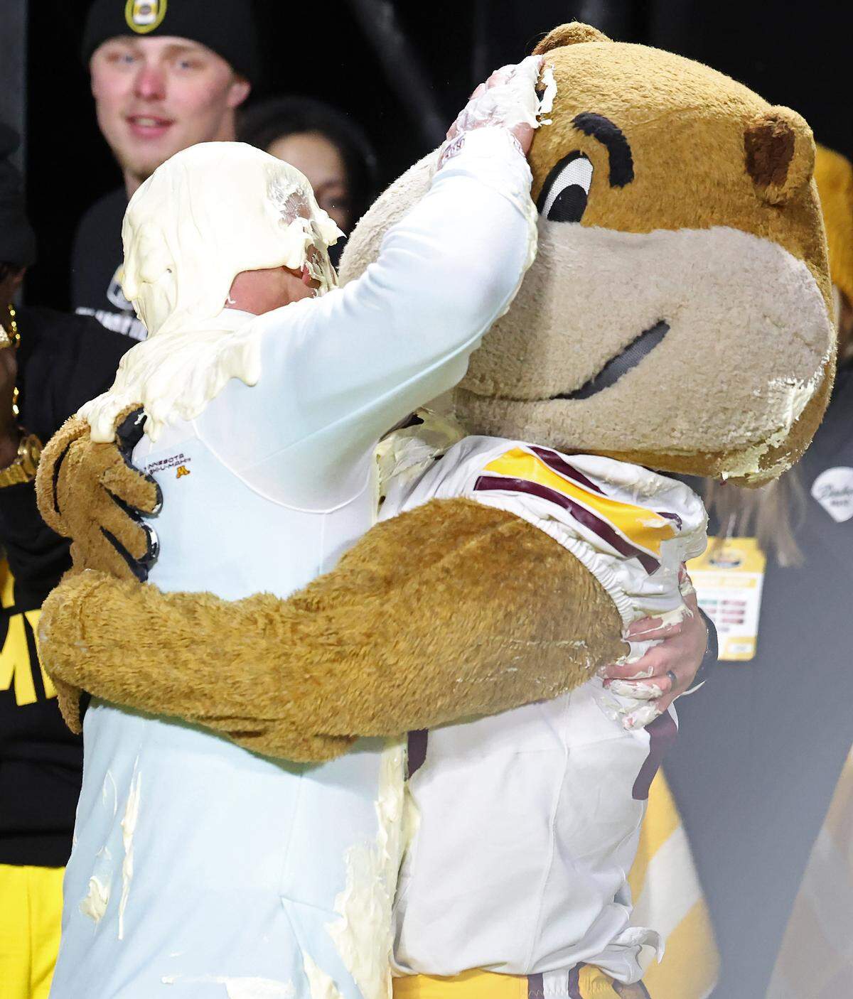 Minnesota Golden Gophers head coach P.J. Fleck, left, grabs school mascot Goldie after he was covered in Duke’s Mayonnaise following the team’s victory over Virginia Tech in the Duke’s Mayo Bowl at Bank of America Stadium in Charlotte, NC on Friday, January 3, 2025. Minnesota defeated Virginia Tech 24-10.