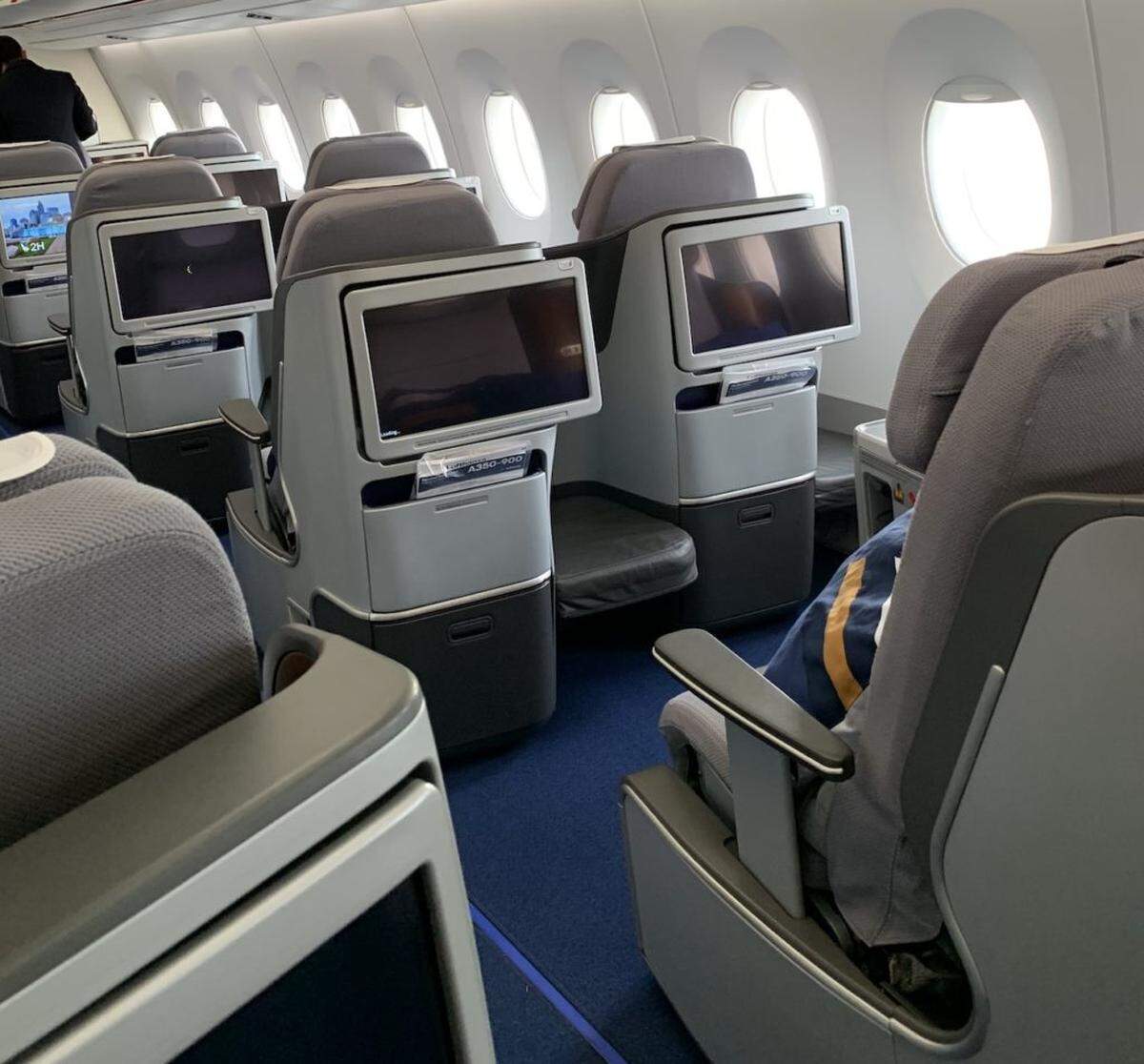 On-board entertainment screens in business class.