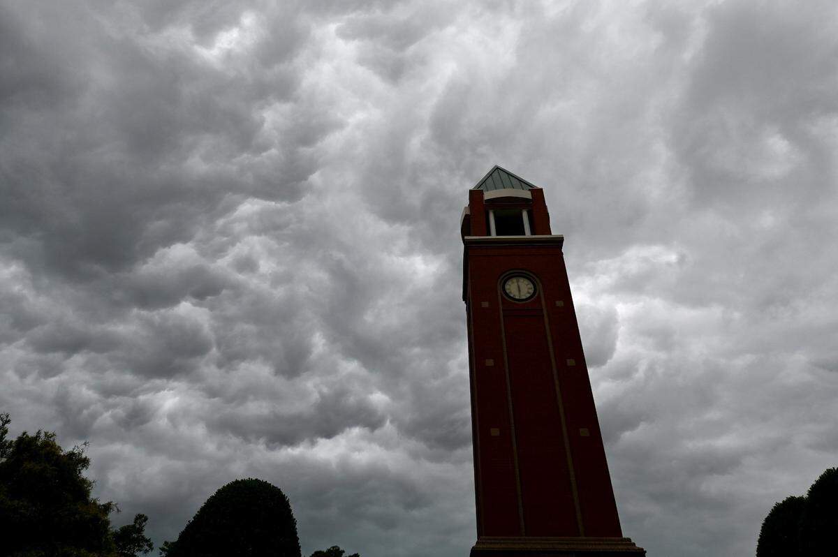Clouds pass over the clock tower in the Village of Lake Park in Union County, which has seen sharp population growth in recent years and become one of the faster growing counties in the state.