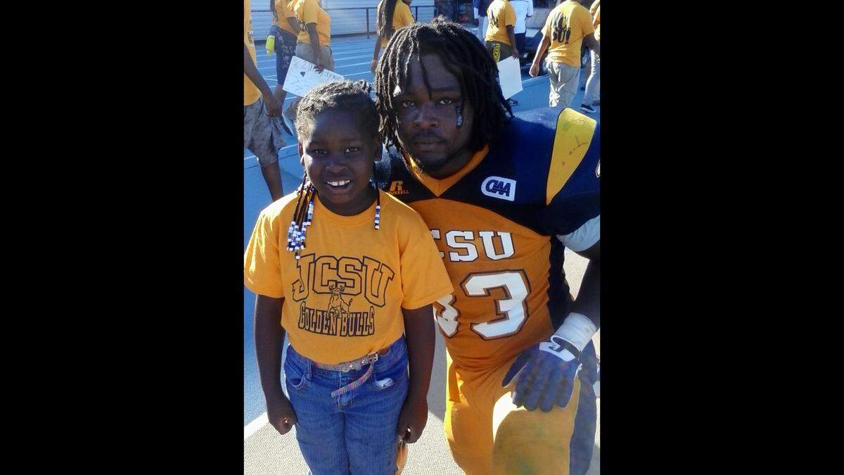 Jovontay Williams and his younger sister at a Johnson C. Smith University football game. Williams died in Charlotte-Mecklenburg Police custody on Monday, June 13.