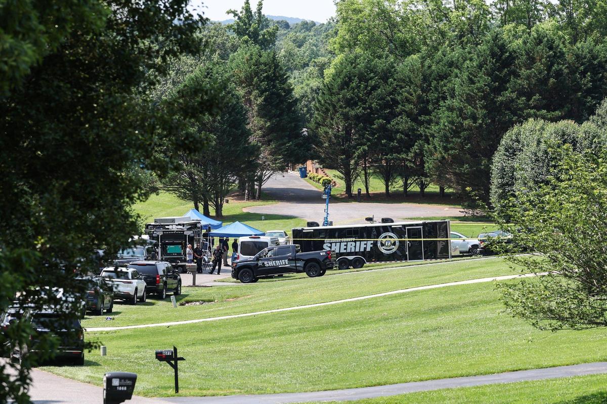 Catawba County sheriff’s deputies investigate the scene of a shooting in the Walnut Acres community in Mountain View on Monday.