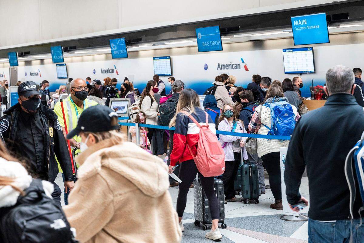 Crowds of people traveling for the Thanksgiving holiday at Charlotte Douglas International Airport on Tuesday, November 23, 2021 in Charlotte, NC. 
