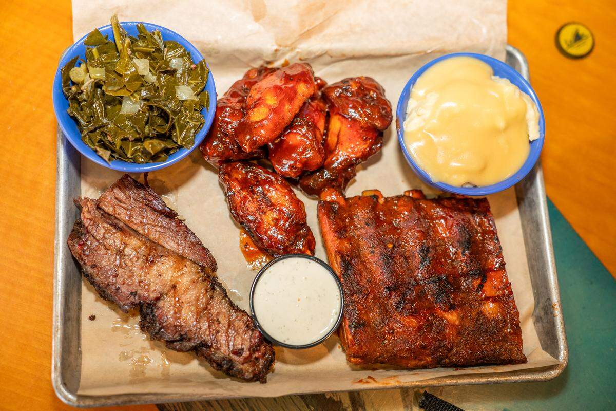 Boardwalk Billy’s Q Combo gives the option of two or three meats including brisket, smoked wings, St. Louis style ribs and two sides.