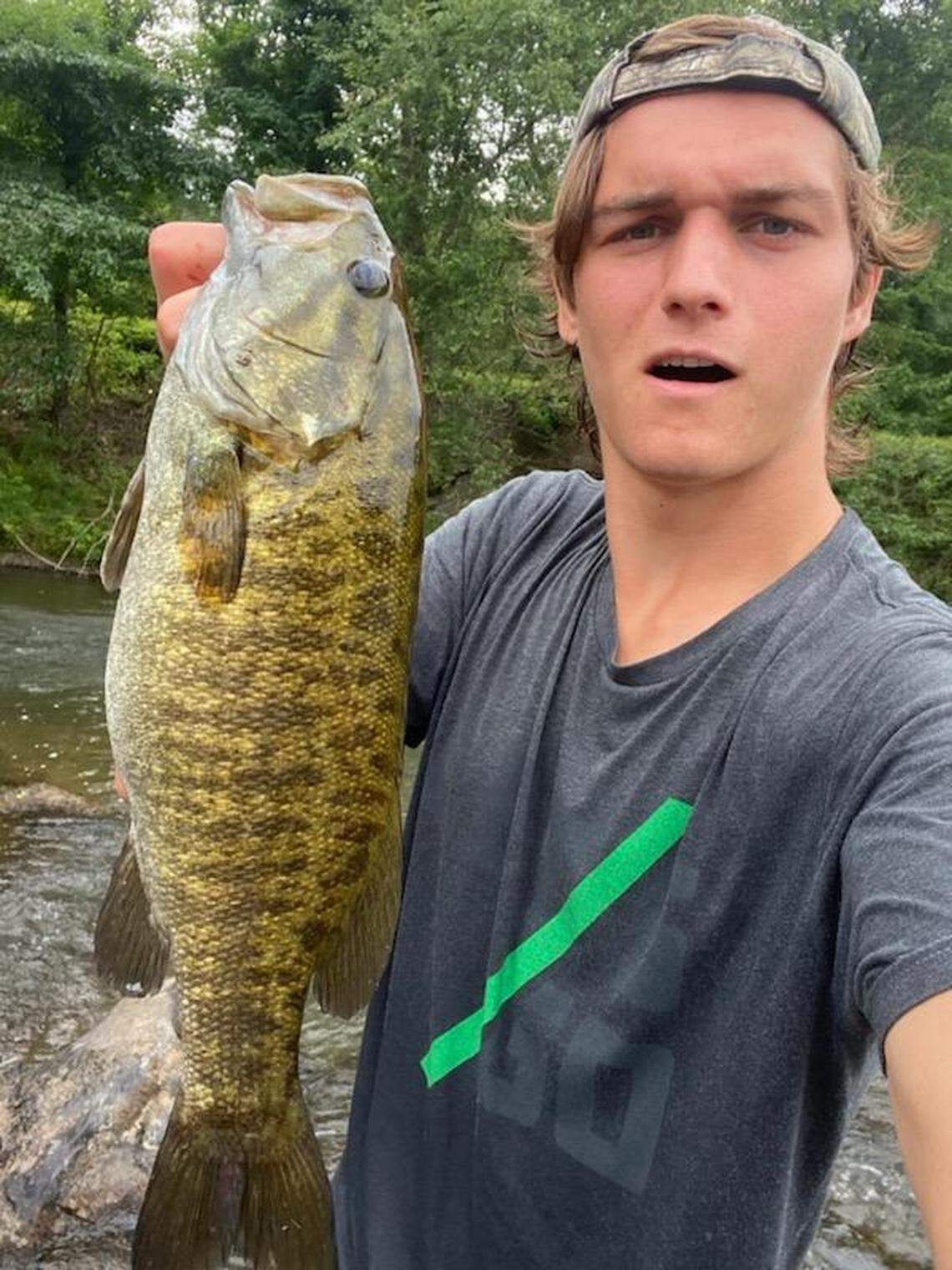 Charlotte FC soccer player Ben Bender shows off a fish he caught.