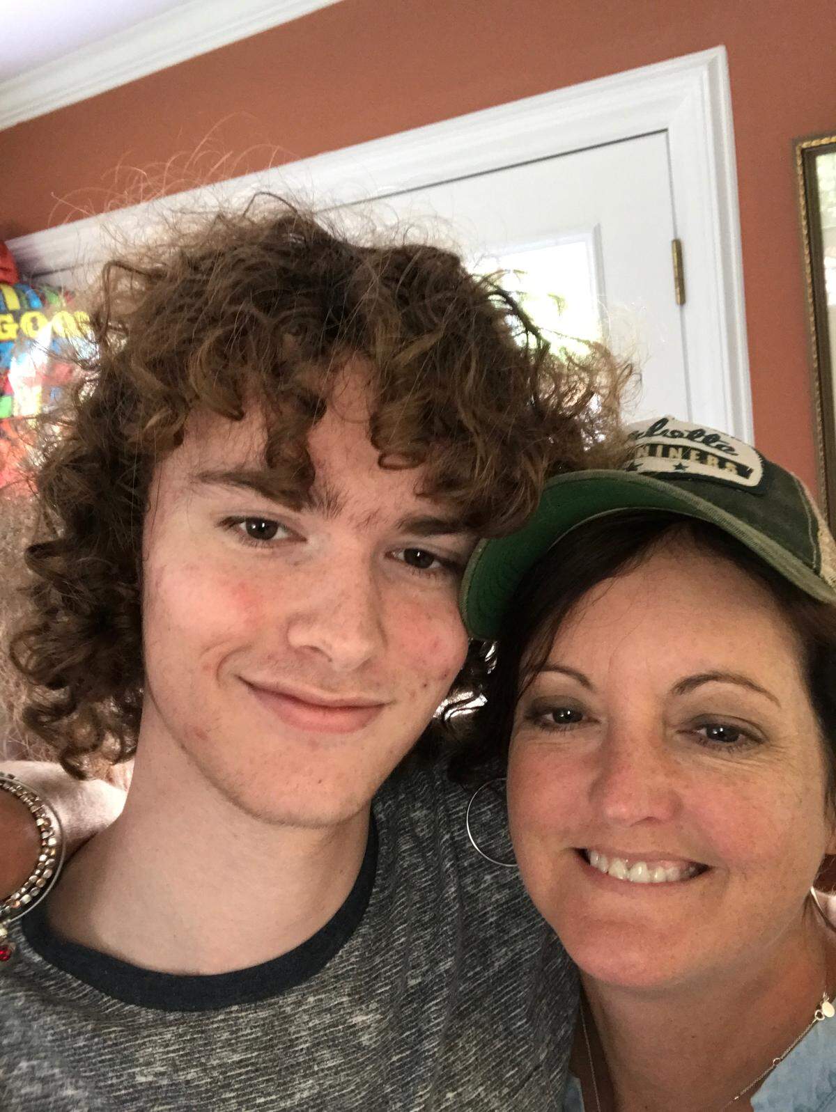 Reed with his mother, Julie Parlier.