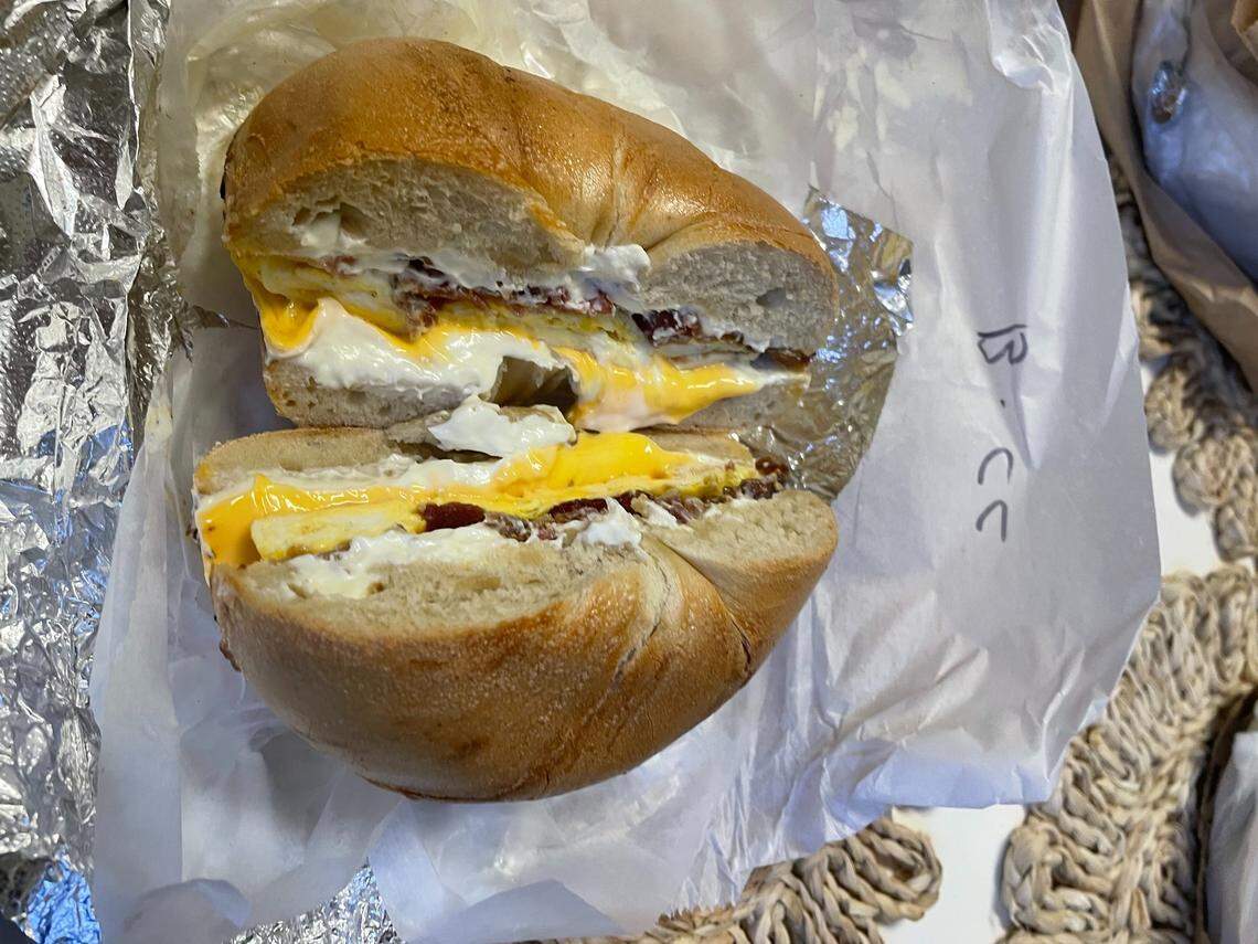 A bacon, egg and cheese bagel with cream cheese in New York City.