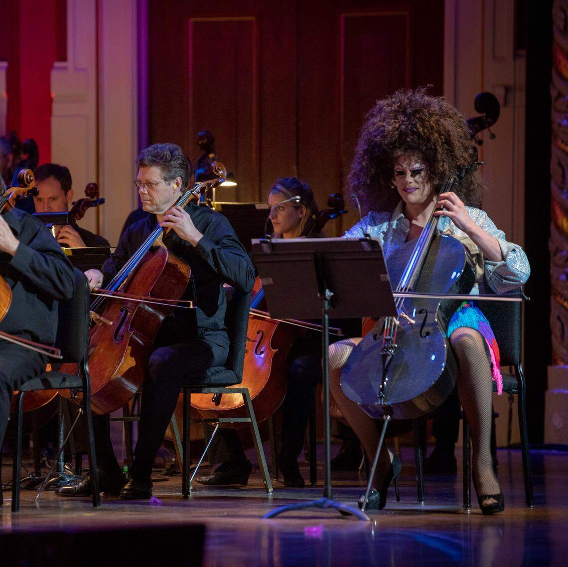 Thorgy Thor stands out in a crowd of orchestra musicians.