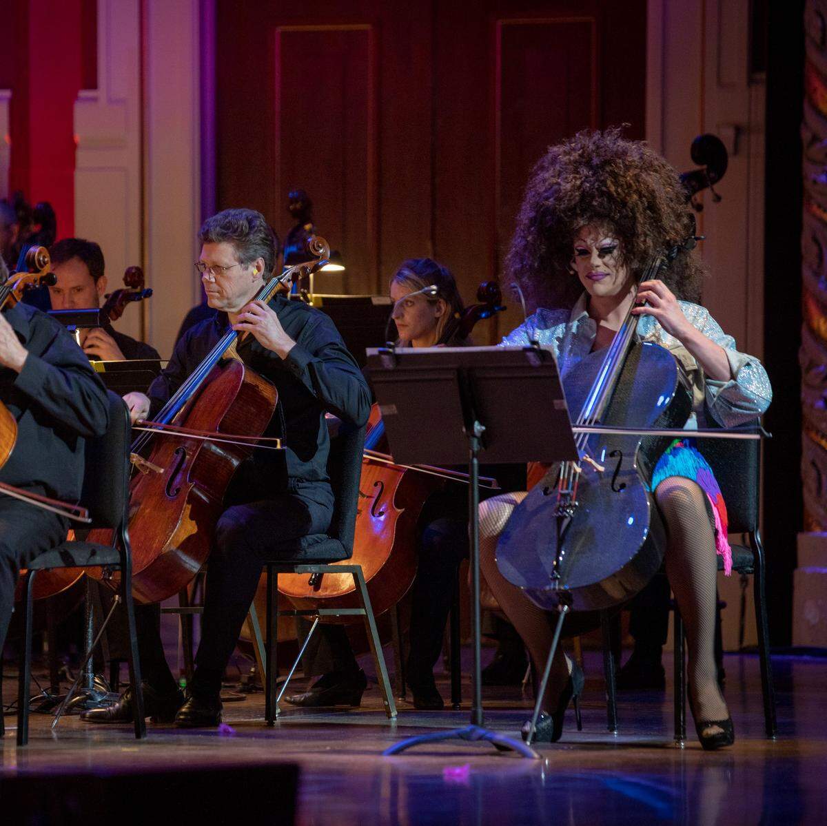 Thorgy Thor stands out in a crowd of orchestra musicians.