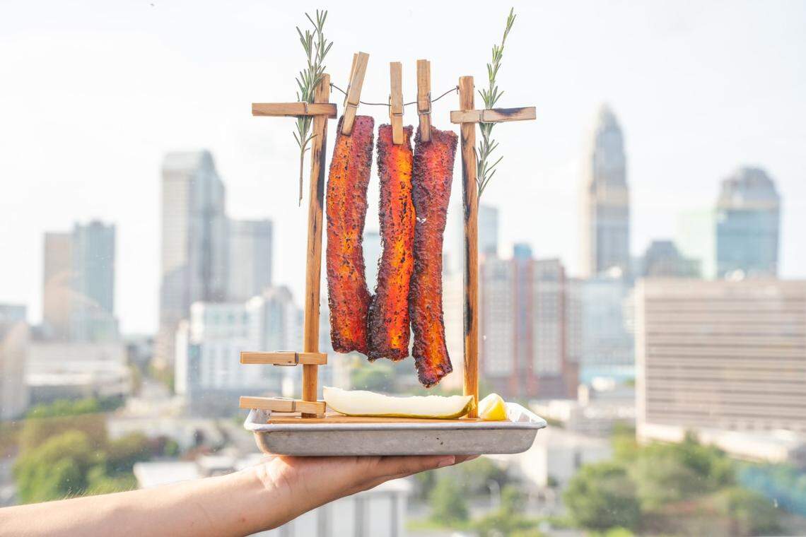 Just look at that bacon grease drip from the DB Maple Glazed Bacon Clothesline, shown here at Cloud Bar by David Burke.
