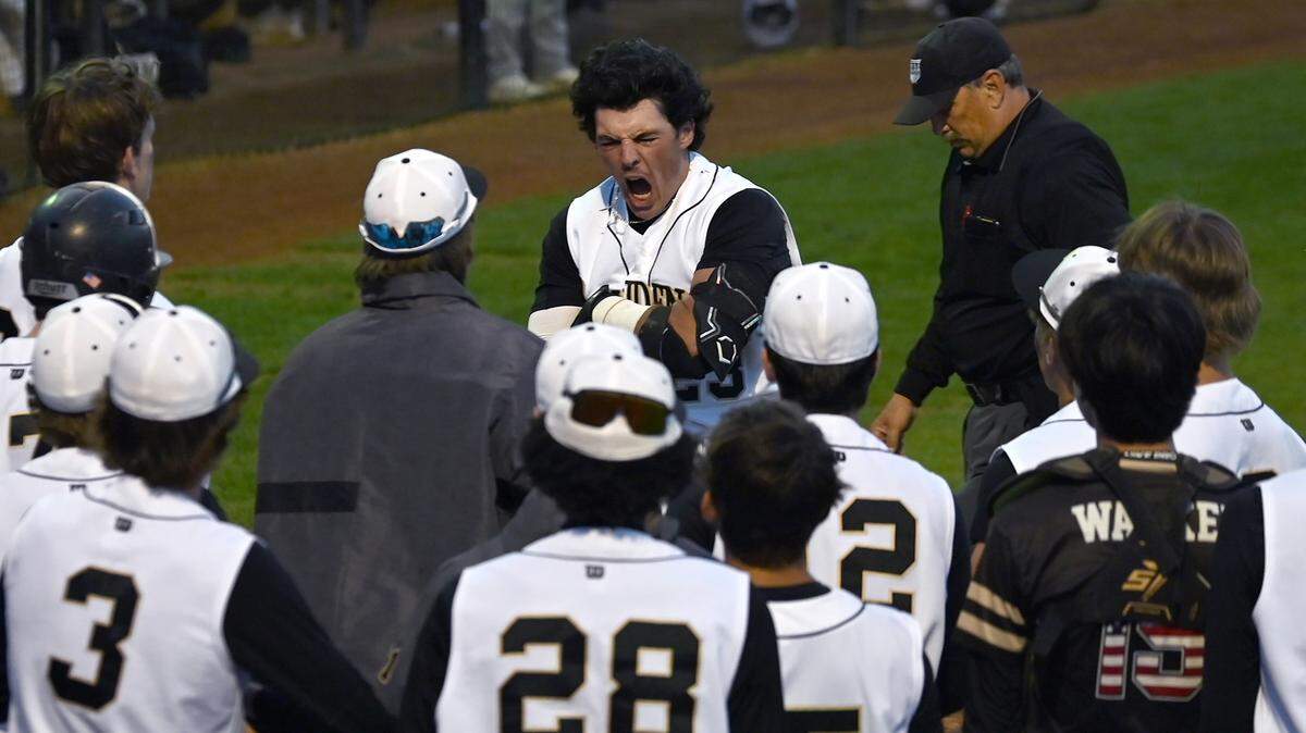Providence Panthers first baseman Ben Baldassarre celebrates his home run as he teammates gather around home plate to congratulate him on Friday, April 12, 2024. Providence hosted Hopewell in prep action.