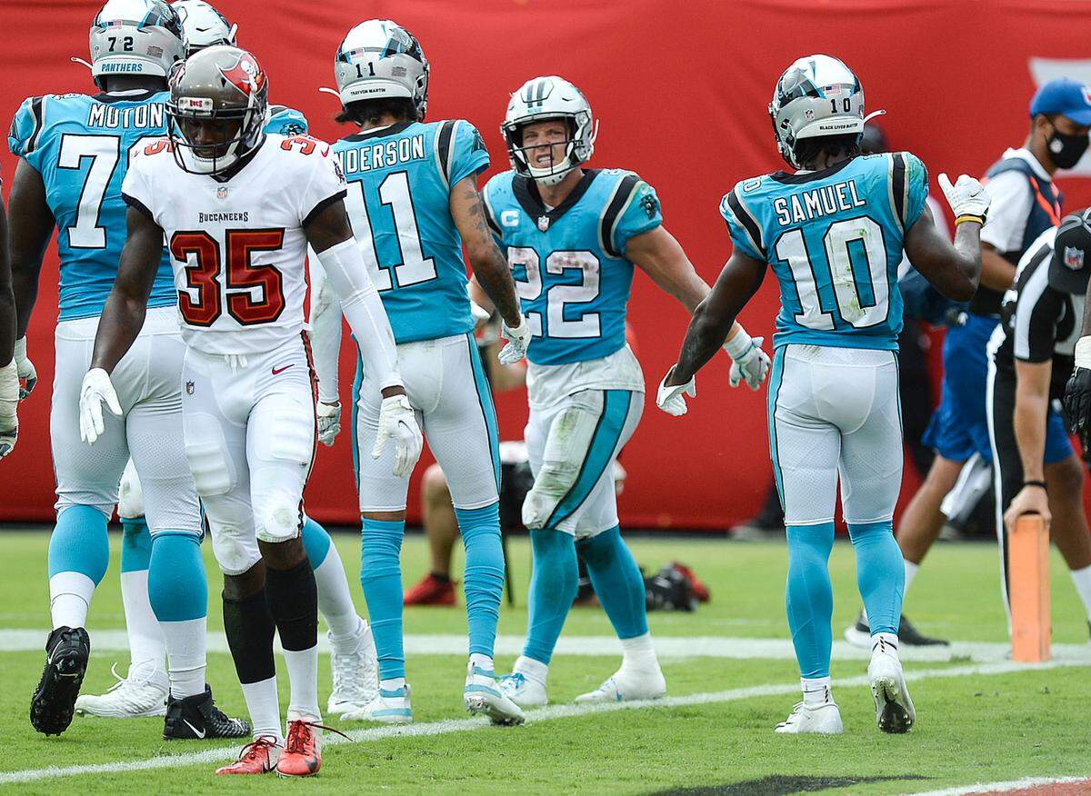 Carolina Panthers running back Christian McCaffrey (22) walks off the field after scoring a touchdown during fourth quarter against the Tampa Bay Buccaneers at Raymond James Stadium on Sunday, September 20, 2020, in Tampa Bay, Florida. McCaffrey injured his ankle during the play and did not return to the game.