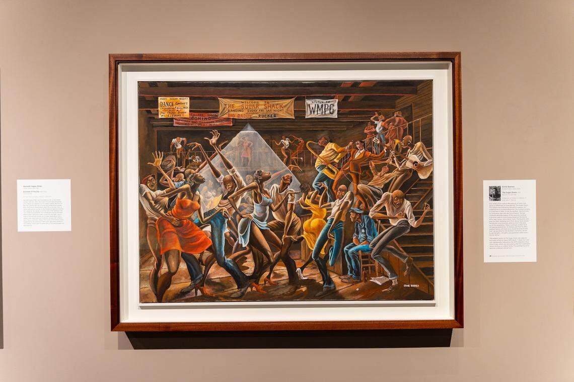 Ernie Barnes’ iconic painting “The Sugar Shack” depicting a lively night at a Black music hall in mid-century segregated North Carolina is on display at The Mint Museum Uptown in Charlotte.