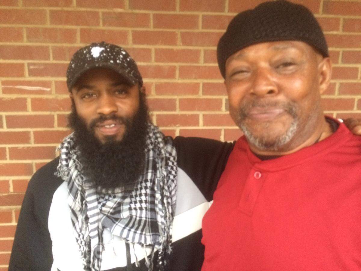 Antonio Dodson, left, and Bill Davis were among evacuees who found shelter at East Mecklenburg High School on Saturday.