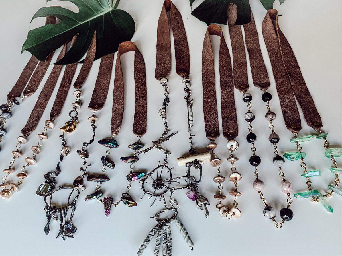 Missy Mace makes and sells whimsical metal earrings, necklaces and rings at Earth’s Gold Designs.