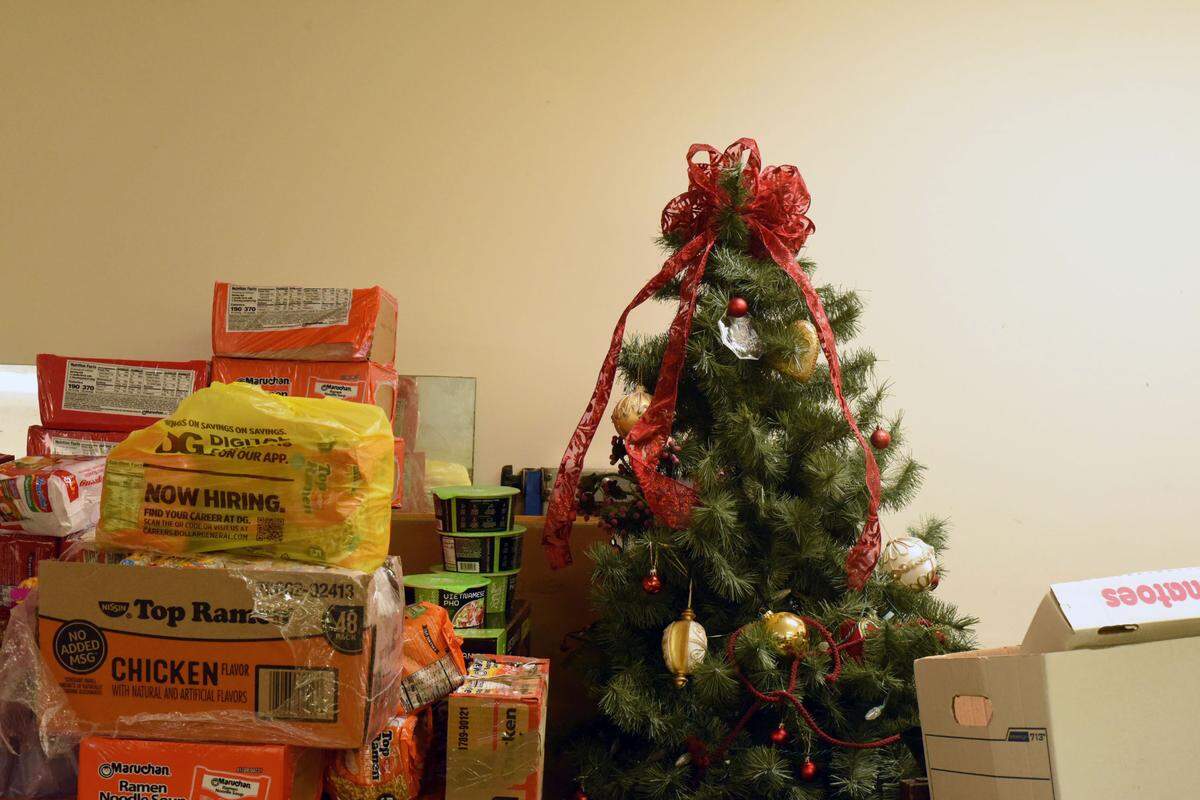A decorated Christmas tree sits among storm-relief donations inside Old White Oak School, which hosted voters from two precincts on Election Day.