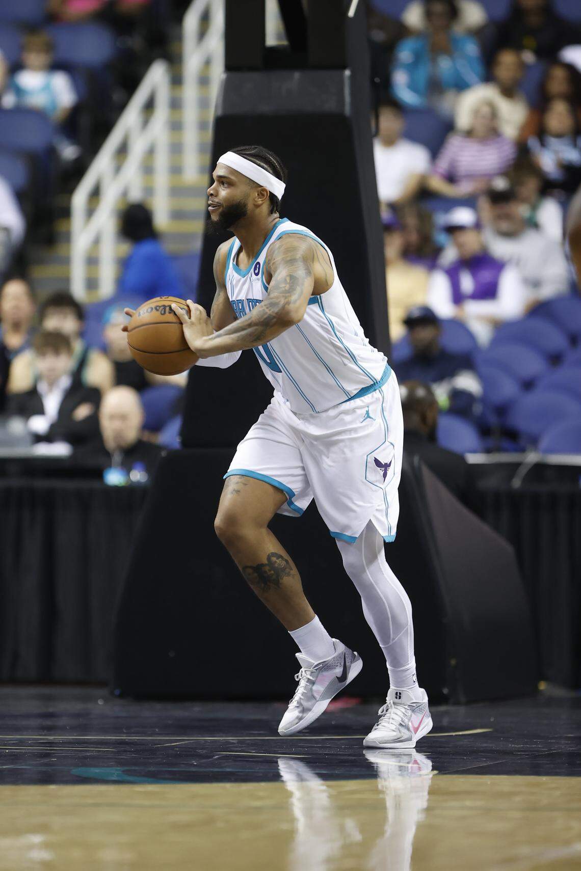 Charlotte Hornets forward Miles Bridges passes the ball against the Memphis Grizzlies in the first half at First Horizon Coliseum. 