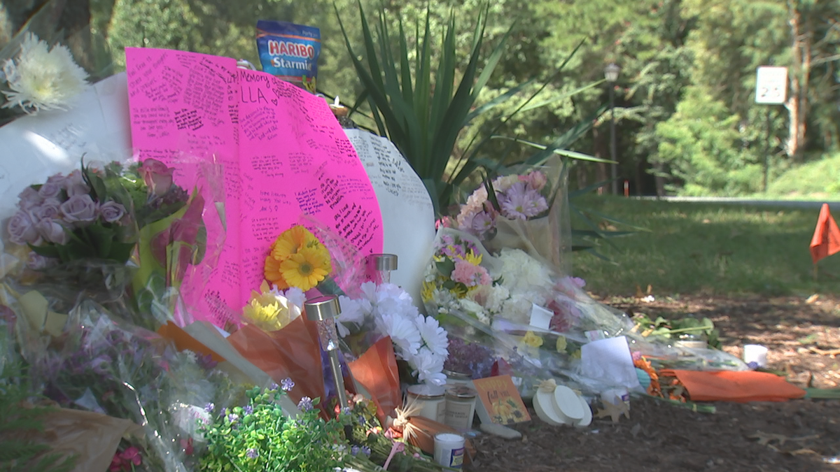A memorial for Ella Lukse, 15, sits on Raintree Road, where she was struck by a car in Charlotte, N.C. on Sunday, Sept. 3, 2023.