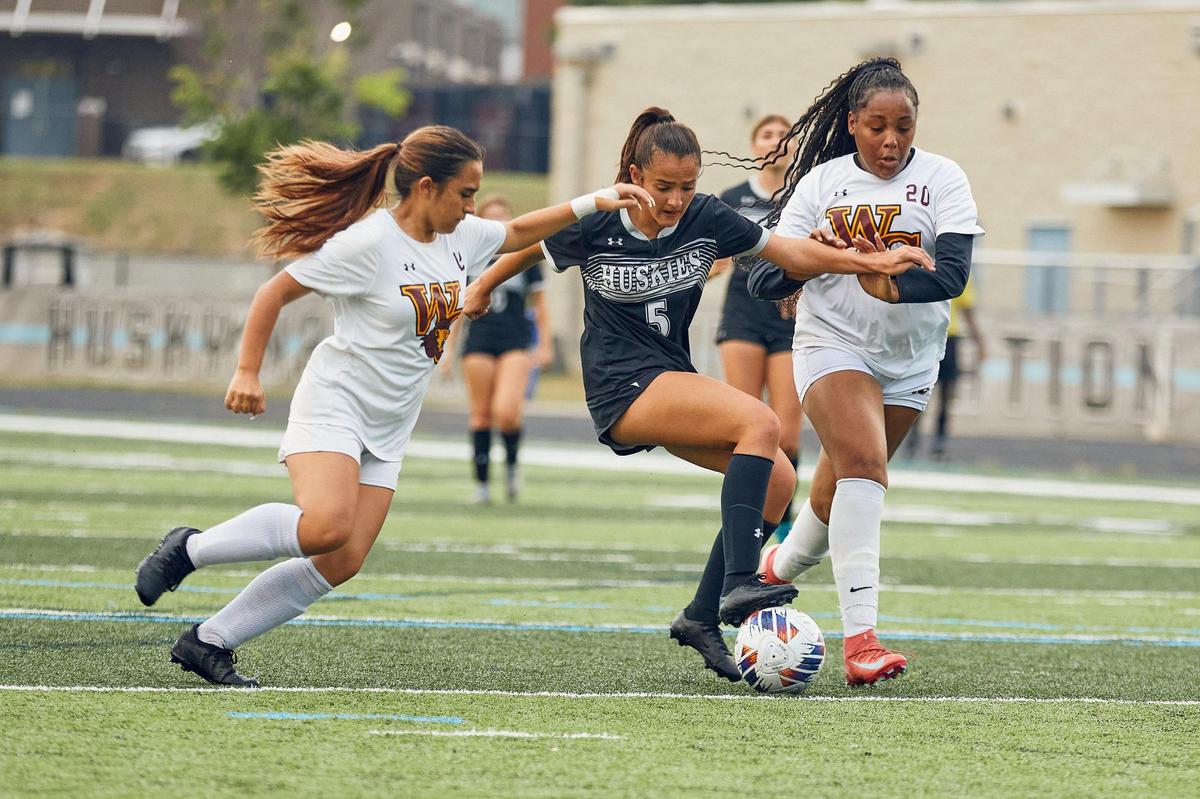 Hough Girl’s Soccer senior midfielder Mia Gradiscaj takes on two West Charlotte defenders and knifes her way through the defense. The Hough Huskies won 10-0 after a mercy rule following halftime.