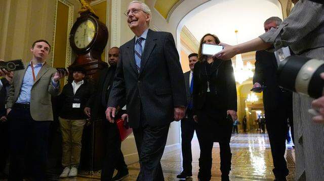 Senate Minority Leader Mitch McConnell of Kentucky heads to the Senate floor on Feb. 28, 2024. 