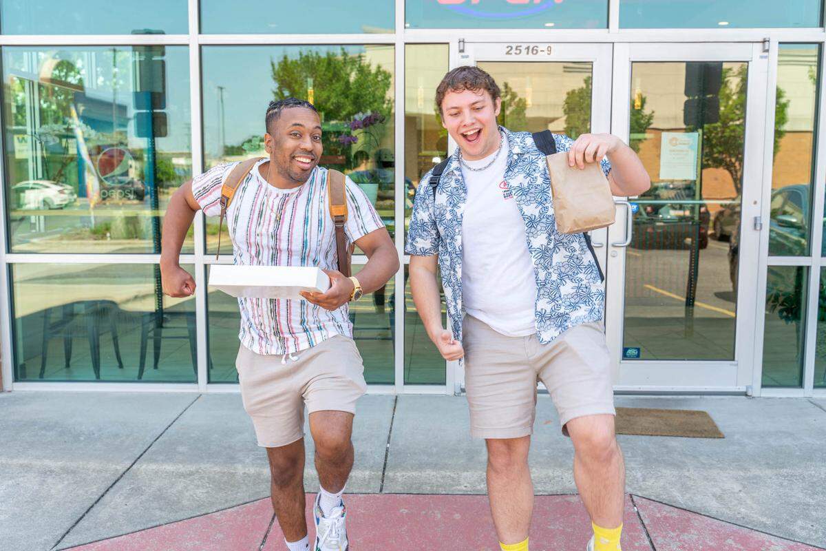 CharlotteFive’s Jonathan Alexander and KJ Edelman outside of Yummm Donut in Gastonia.