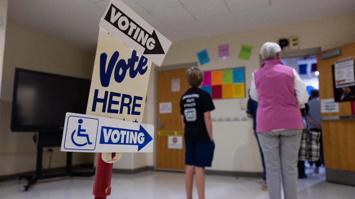 Voters wait in line to check in to vote at Myers Park Traditional Elementary School in Charlotte, N.C., on Tuesday, November 7, 2023.