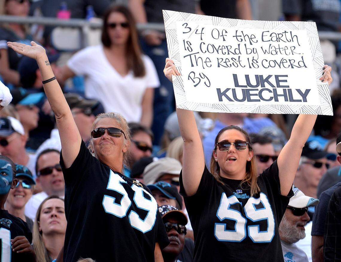 Carolina Panthers fans celebrate the play of Panthers linebacker Luke Kuechly during action at Bank of America Stadium against the Arizona Cardinals in Charlotte, NC on Sunday, October 30, 2016. The Panthers defeated the Cardinals 30-20.