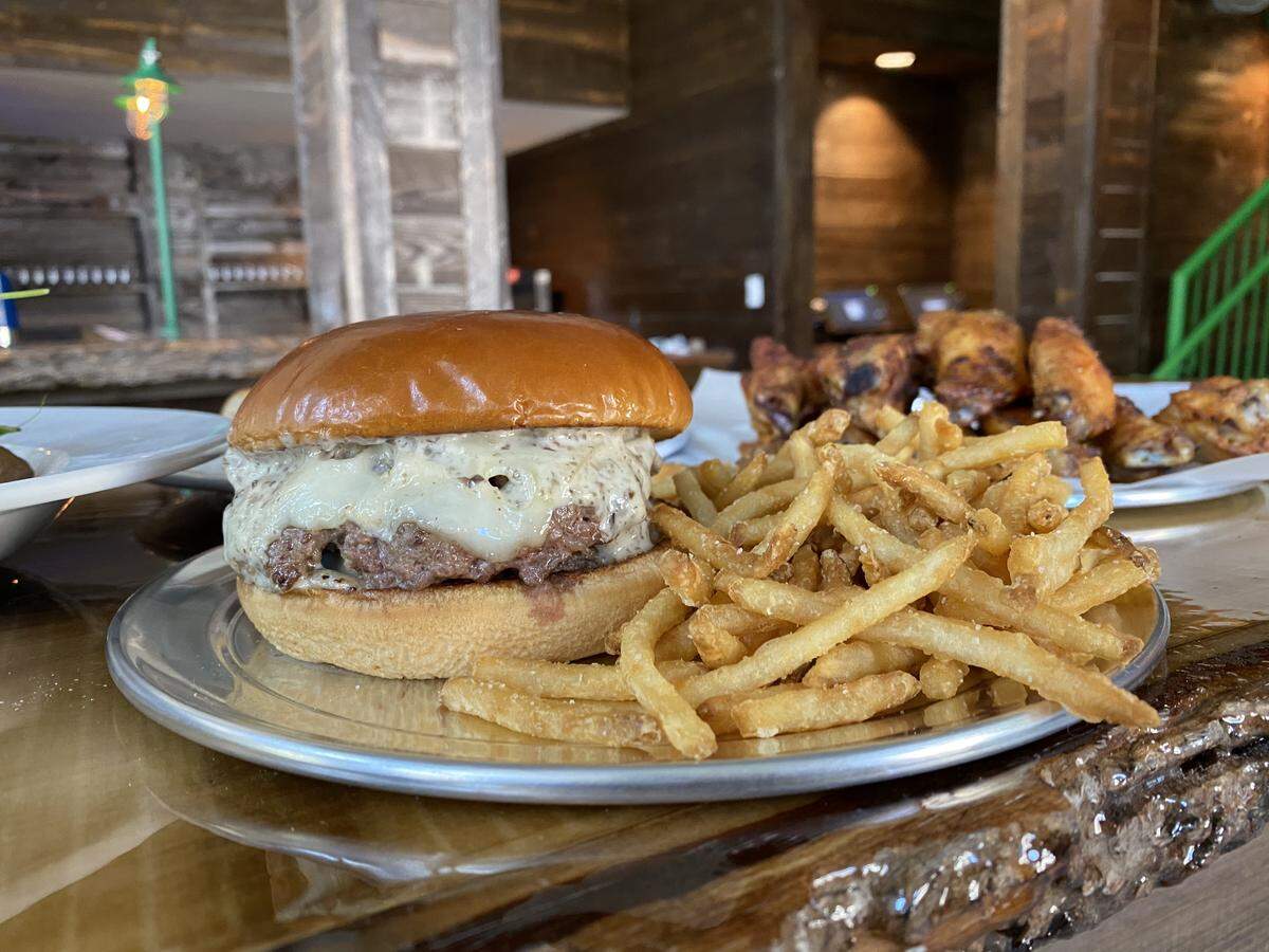 At Charlotte Beer Garden, you can order a Mushroom Burger: two 4-ounce patties topped with caramelized onion and mushroom duxelles aioli and served on a brioche bun.