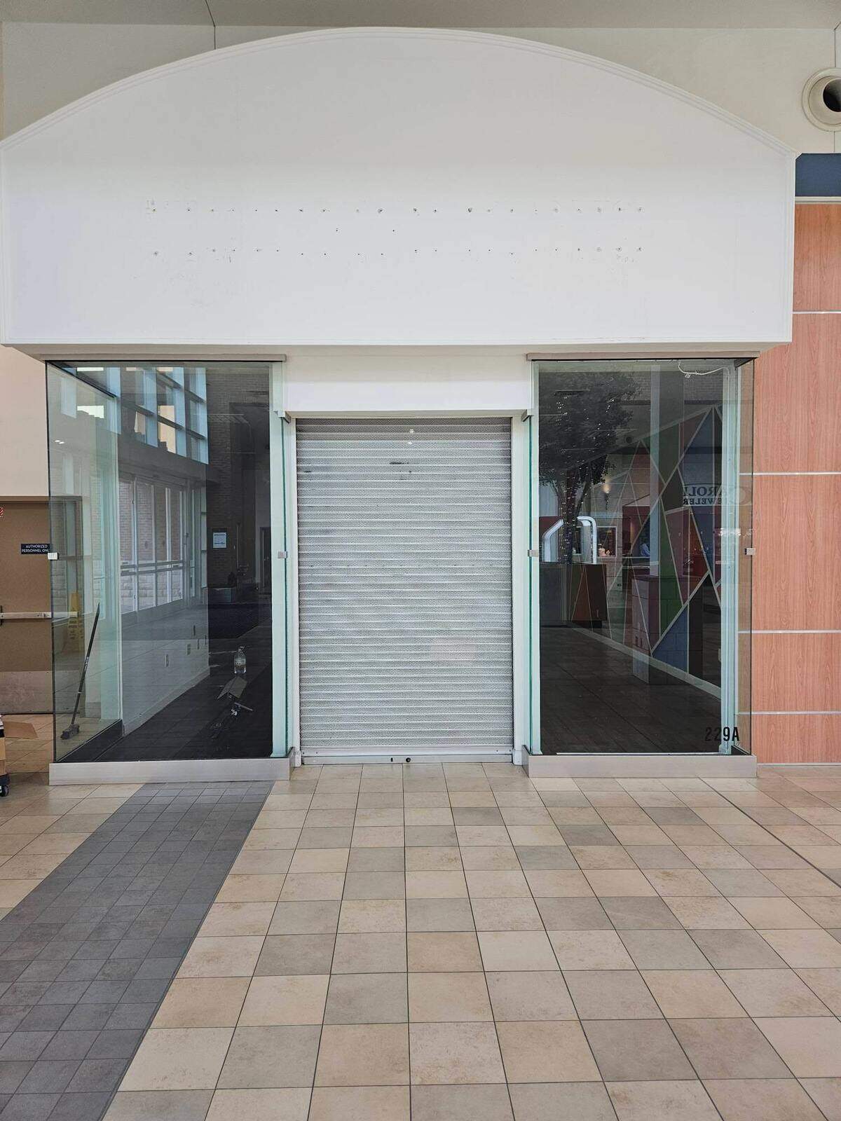 Modified Kicks owner Danyell Butler said he and other small businesses were forced to leave Northlake Mall under new property owner Hull Property Group. The closed store has been walled over like many other vacant businesses at the mall.