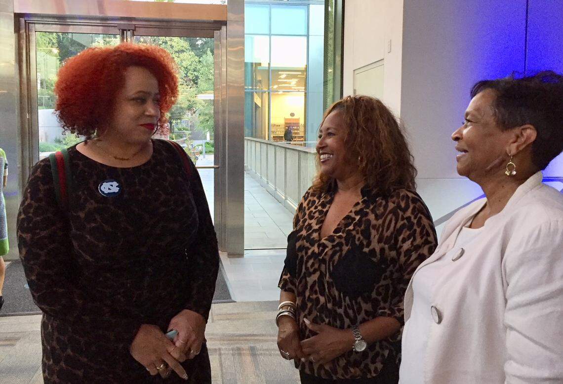 Education reporter Nikole Hannah-Jones (left) talks with Minnie Forte-Brown (center), a Durham school board member and president of the North Carolina School Boards Association, and Charlotte-Mecklenburg school board chair Mary McCray.