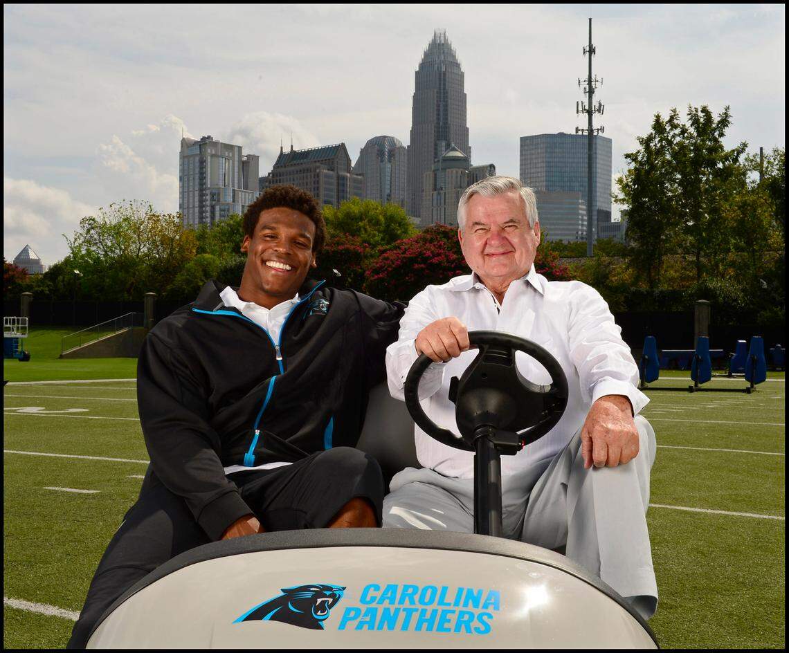 In 2012, Carolina Panthers quarterback Cam Newton and team owner Jerry Richardson posed for a photo.