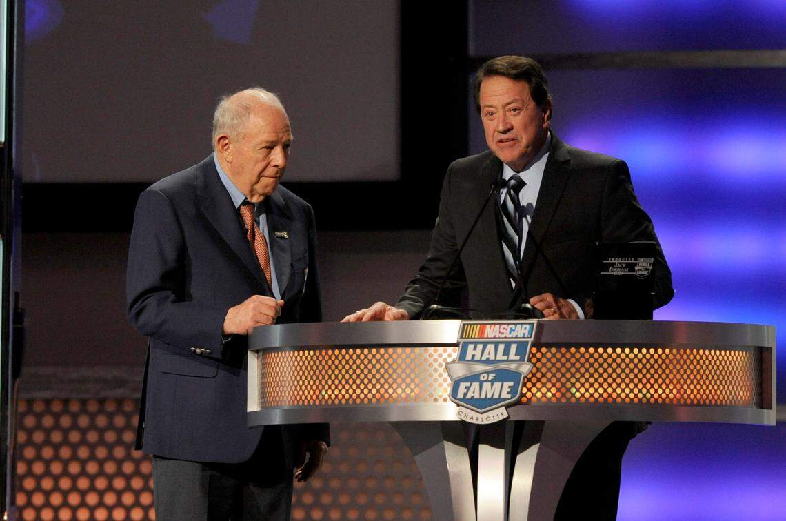 Jan 29, 2014; Charlotte, NC, USA; NASCAR driver Jack Ingram (left) is inducted into the NASCAR Hall of Fame by Harry Gant (right) during the NASCAR hall of fame induction ceremony at NASCAR Hall of Fame.