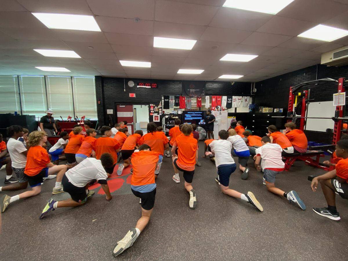 The Ballantyne Ridge football team inside the South Mecklenburg High School weight room.