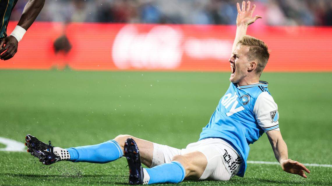 Charlotte FC Karol Swiderski throws his hands up on the ground during the match against LA Galaxy at the Bank of America Stadium in Charlotte, N.C., on Saturday, March 5, 2022.