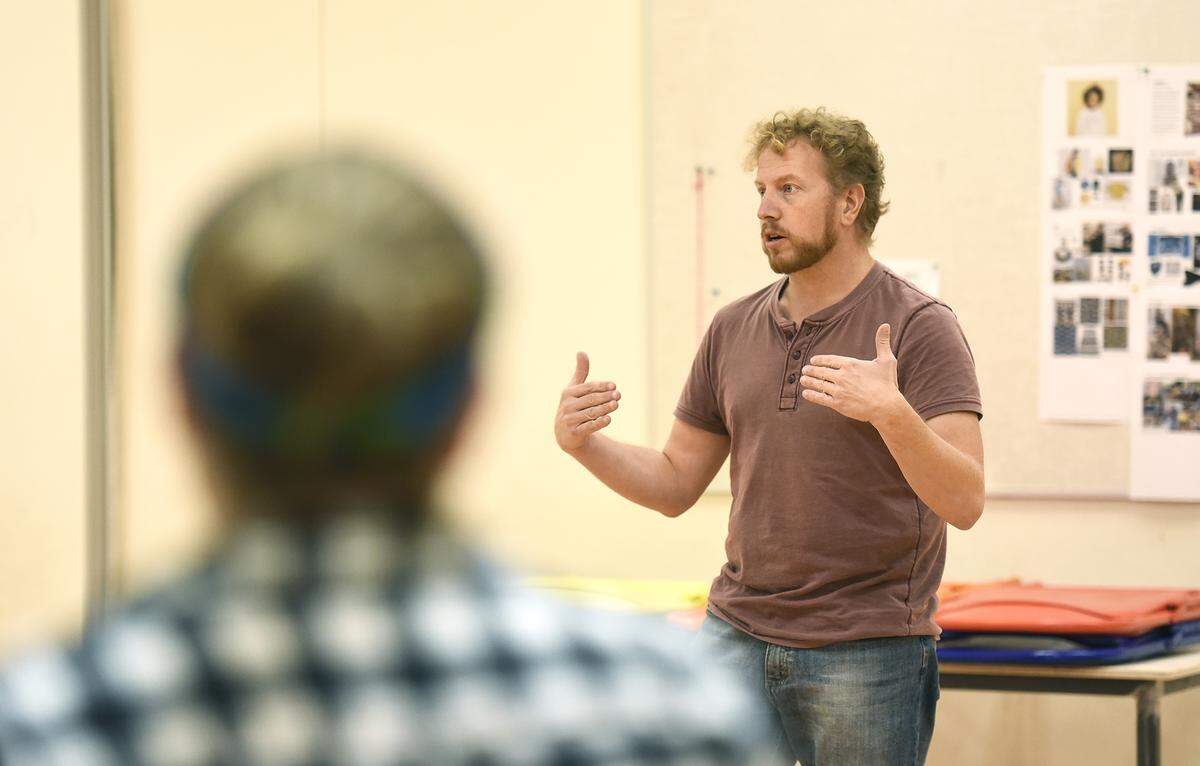 Chris Parks, director of the “Last Stop on Market Street,” kicks off a recent rehearsal.