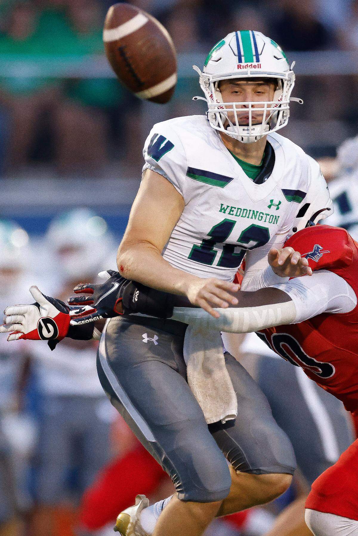 Providence Day’s David Sanders (70) tackles Weddington’s Tyler Budge (12) during a game at Providence Day in Charlotte, N.C., Friday, Aug. 26, 2022.