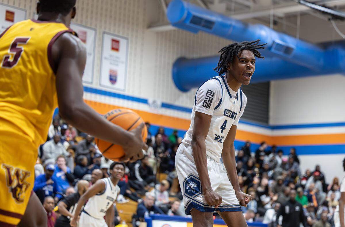 Queen’s Grant Stallions player Mekhi Allen celebrates after making a dunk against the West Charlotte Lions during the Mike Gminski Classic at Marvin Ridge High School in Waxhaw, North Carolina, on Monday, Dec. 29, 2025.