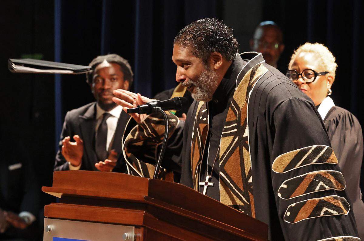 Rev. William Barber II tosses his eulogy notes aside as he speaks during a memorial service for Maj. Gen. Joseph McNeil at North Carolina A&T State University in Greensboro on Thursday. 