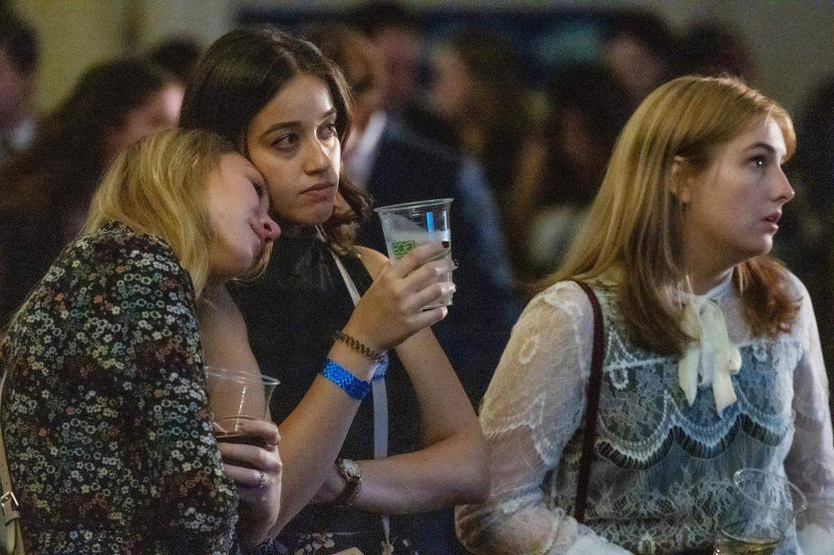 Supporters of U.S. Senate Democrat candidate Cheri Beasley from left, Ava Bowman Thomas, Emily Mintz and Haley Hendrick&nbsp;watch election results during an election watch party Tuesday, Nov 8, 2022 at the Sheraton in downtown Raleigh.